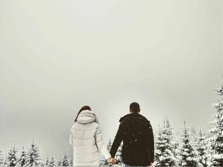 A man who found Ukraine love and holding hands with a Ukrainian woman.