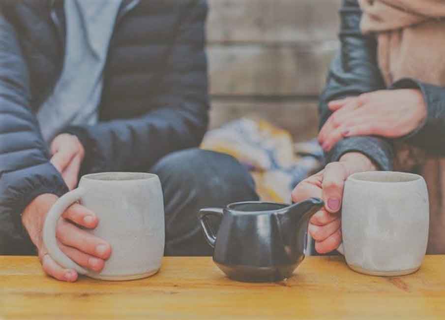 Mugs of coffee or tea on a table